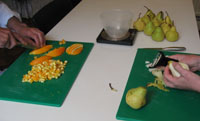 image of oranges and pears being chopped